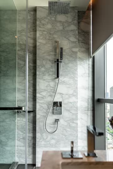 modern bathroom interior with stainless steel shower set white natural marble wall interior design copy space 175368 240